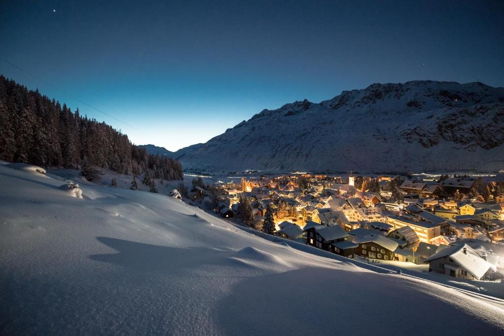 Andermatt Switzerland snow covered at night.